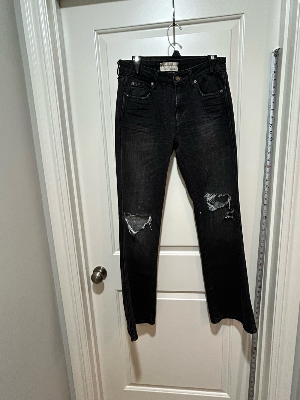 Free People women’s size 28 or a Small Size 6 Black Distressed flare Jeans